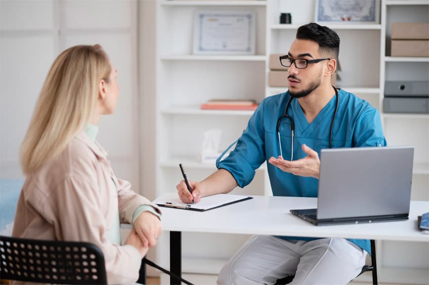 Doctor consulting with an elderly patient